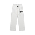 FEAR OF GOD FOG ESSENTIALS Flocked 1977 Straight‑Leg Sweatpants Men